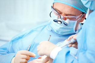 dental surgeon fulfilling an oral surgery procedure 