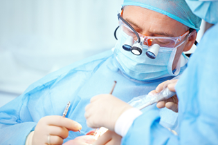 dental surgeon fulfilling an oral surgery procedure