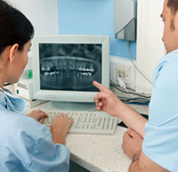 two dentists using x-ray photographs Dentistry Technology